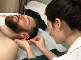 Patient receiving auricular acupuncture